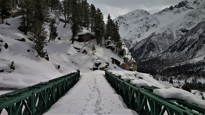 Bridge covered with snow on way to Chitkul in winters