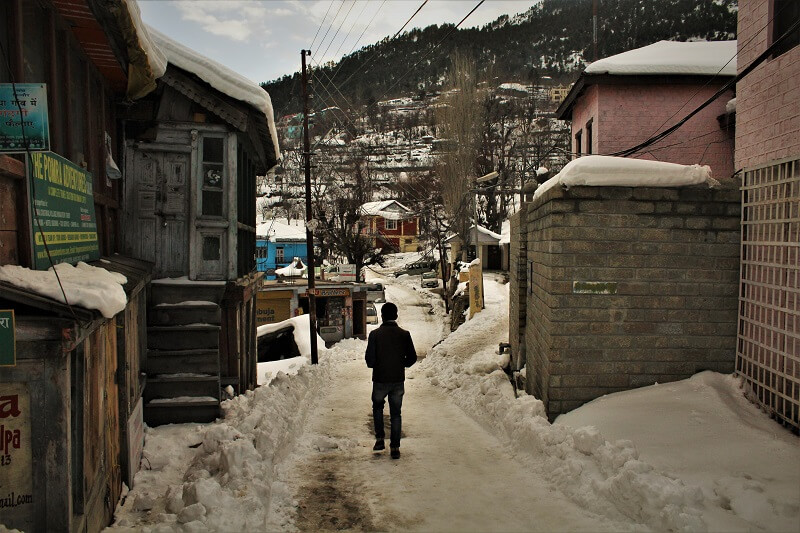 Friend walking on streets of Kalpa in Himachal