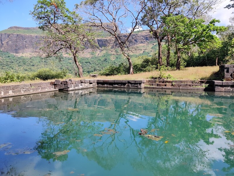 Small water body as seen on trek route to Harihar Fort