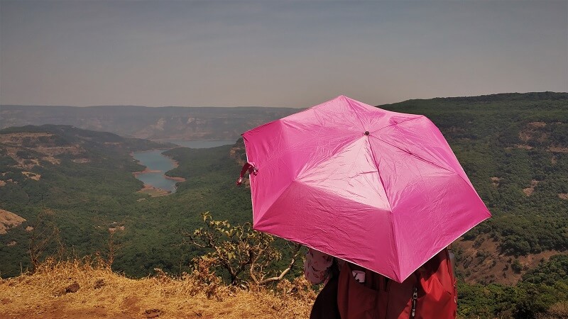 Umbrella with Koyna river in background